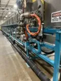 Berndorf Band Group double belt cooler side view in ChemPak International, Inc. facility